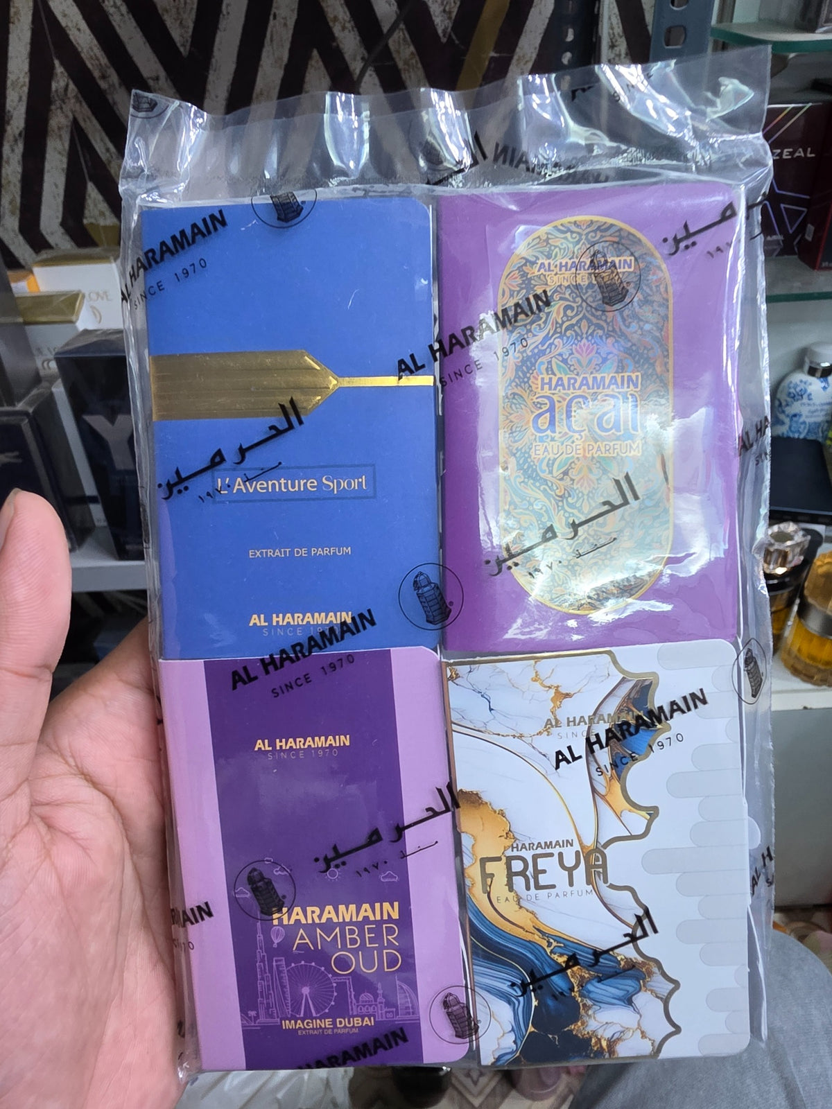 Al Haramain four-vial fragrance set in sealed branded packaging featuring L'Aventure Sport, Acai, Amber Oud Imagine Dubai and Freya