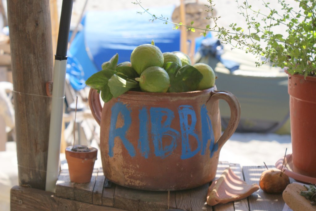 Green bergamot fruits arranged in a terracotta bowl