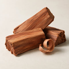 Cedarwood pieces representing the cedarwood fragrance note