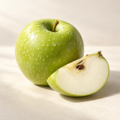 Representative one crisp bright green apple and a freshly cut wedge, realistic pale flesh and brown seeds imagery for fragrance-note discovery