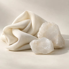 Conceptual soft fabric and mineral forms representing the musk fragrance note