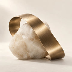 Conceptual metal and mineral forms representing the Sclarene fragrance note