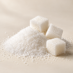 Representative a small mound of clean white granulated sugar with three white sugar cubes imagery for fragrance-note discovery