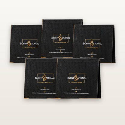 Five ScentsSational Dice Collection gift sets displayed in a minimalist luxury studio photo